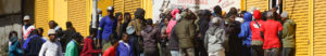 People break in to a shop in Kliptown , Soweto. [photo: Alamy]