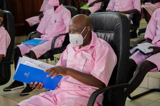 Paul Rusesabagina sits in a Kigali courtroom