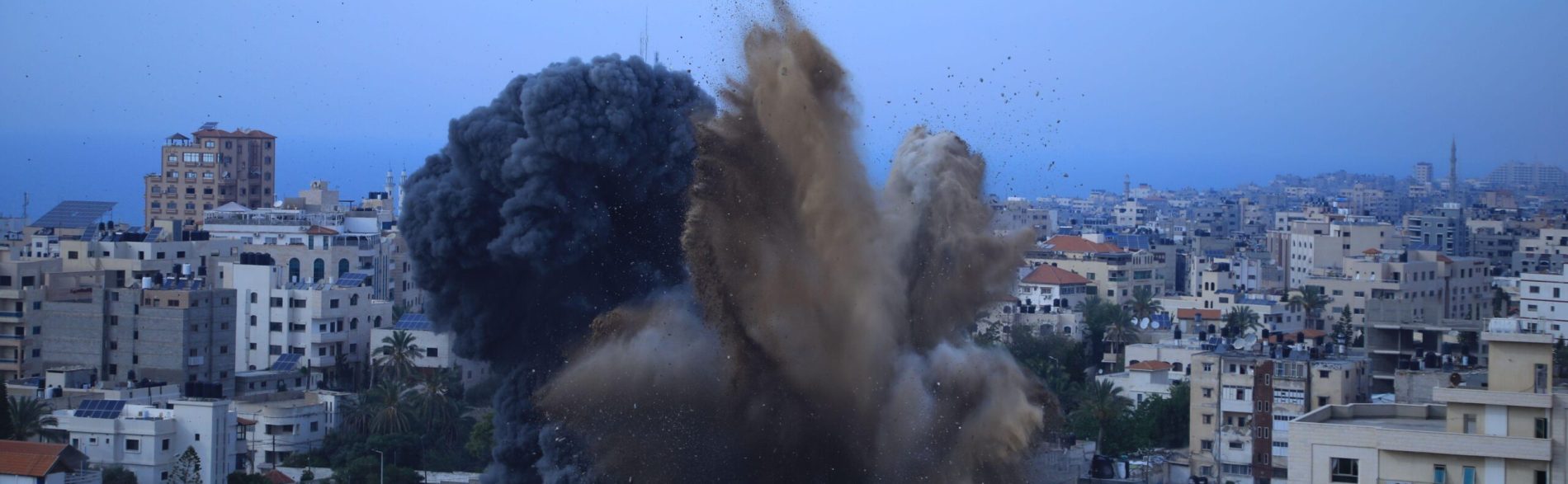 Can the Commonwealth respond and help avert a catastrophe? photo shows Gaza under attack