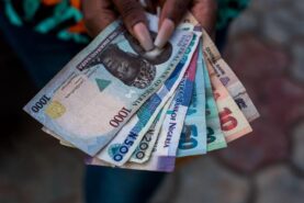 A person holding money: The Bank of Nigeria plans to redesign the Naira note. Showcase a variety of Nigerian banknotes. Contributor: Tolu Owoeye / Alamy Stock Photo