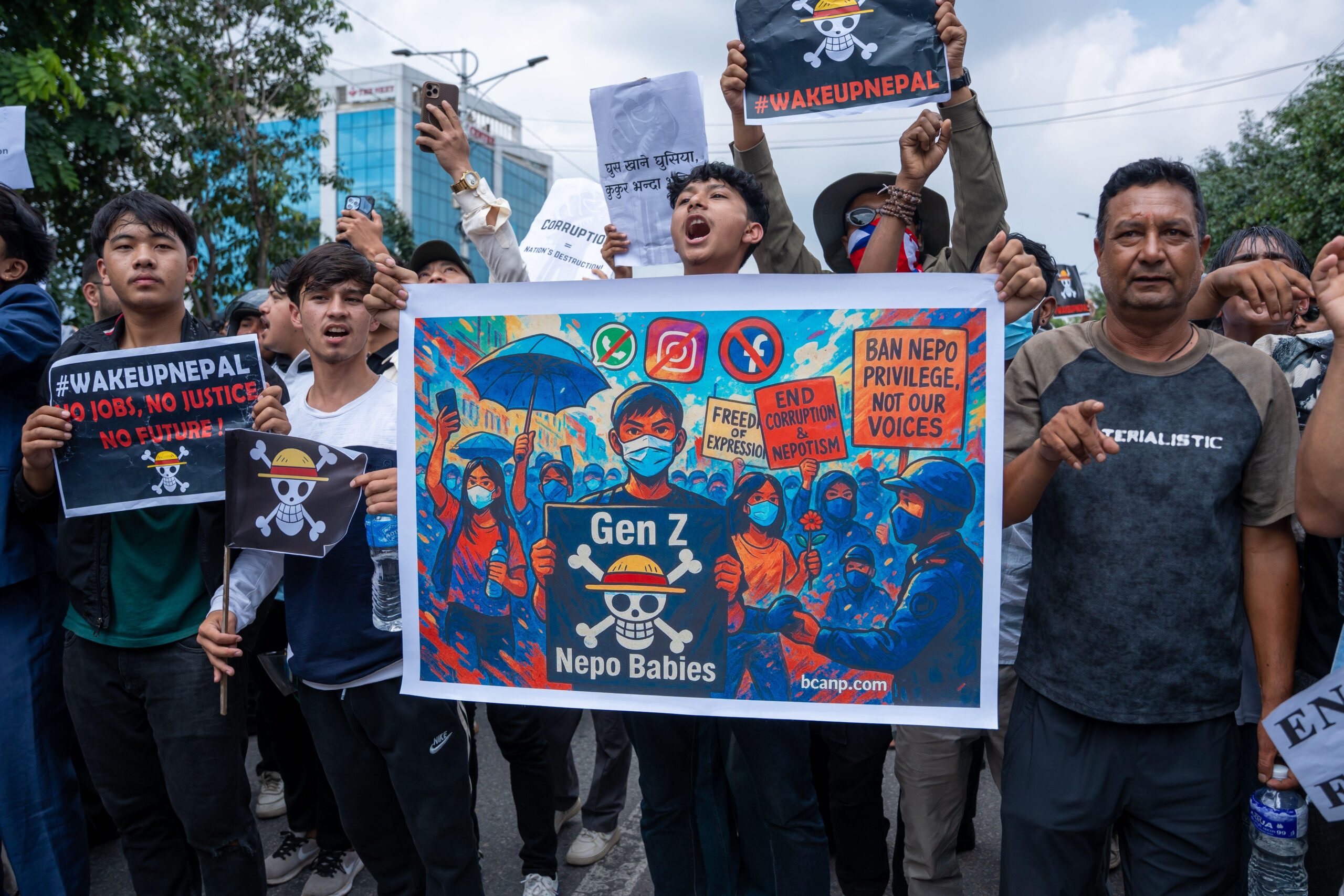 Restless republic: Nepal’s Gen Z uprisings and the crisis of political legitimacy. photo shows protestors with posters on 9 September 2025